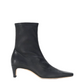 A single black leather ankle boot with a pointed toe and a slim kitten heel, shown in profile against a plain white background.